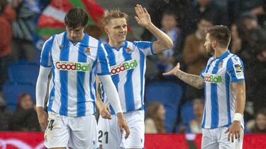 Le Normand, Odegaard y Portu, con la Real.