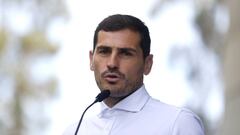 Spanish soccer player Iker Casillas speaks to journalists before he leaves CUF Porto hospital accompanied by his wife Sara Carbonero in Porto