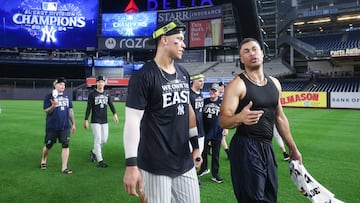 Sep 26, 2024; Bronx, New York, USA; New York Yankees center fielder Aaron Judge, left, and designated hitter Giancarlo Stanton walk off the field after defeating the Baltimore Orioles to clinch the American League East title at Yankee Stadium. Mandatory Credit: Vincent Carchietta-Imagn Images