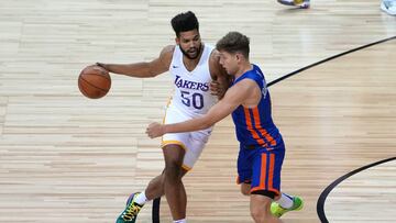 Aug 11, 2021; Las Vegas, Nevada, USA; Los Angeles Lakers forward Yoeli Childs (50) dribbles against New York Knicks guard Rokas Jokubaitis (0) during an NBA Summer League game at Thomas &amp; Mack Center. Mandatory Credit: Stephen R. Sylvanie-USA TODAY Sports