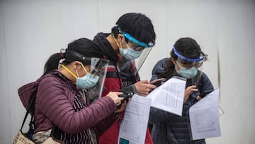 Passengers arrive at Jorge Chavez International Airport in Lima on July 15, 2020 as airports across Peru reopened for domestic flights as part of the easing of measures against the COVID-19 novel coronavirus pandemic. (Photo by Ernesto BENAVIDES / AFP)