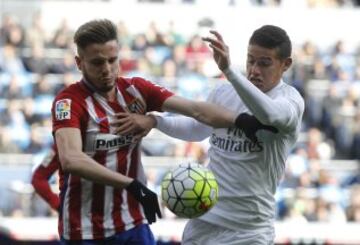 Saúl and James tussle for the ball.