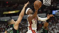 Miami Heat forward Jimmy Butler drives to the basket between Boston Celtics forward Grant Williams and guard Jaylen Brown during the fourth quarter of game five of the 2022 eastern conference finals at FTX Arena.