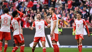 Bayern Munich's English forward #09 Harry Kane (R) celebrates scoring his team's seventh goal with team mates during the German first division Bundesliga football match Bayern Munich v Mainz 05 in Munich, southern Germany on March 9, 2024 (Photo by LUKAS BARTH / AFP) / DFL REGULATIONS PROHIBIT ANY USE OF PHOTOGRAPHS AS IMAGE SEQUENCES AND/OR QUASI-VIDEO