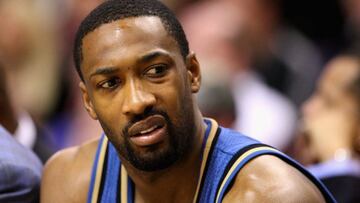 PHOENIX - DECEMBER 19:  (FILE PHOTO) Gilbert Arenas #0 of the Washington Wizards sits on the bench during the NBA game against the Phoenix Suns at US Airways Center on December 19, 2009 in Phoenix, Arizona. Arenas was charged with a felony after he brought a handgun outside of his home without a license to the Verizon Center on December 21, 2009 in Washington, DC. NOTE TO USER: User expressly acknowledges and agrees that, by downloading and or using this photograph, User is consenting to the terms and conditions of the Getty Images License Agreement.  (Photo by Christian Petersen/Getty Images) ORG XMIT: 95653773 GTY ID: 42043CP021_WASHINGTON_WI