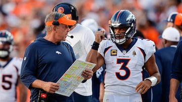 Denver Broncos head coach Sean Payton talks with quarterback Russell Wilson (3)