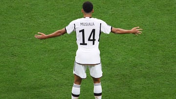 (FILES) Germany's midfielder Jamal Musiala gestures during the Qatar 2022 World Cup Group E football match between Spain and Germany at the Al-Bayt Stadium in Al Khor, north of Doha on November 27, 2022. The 20 year-old Jamal Musiala will be playing with the German national team again for the June 2023 friendly matches. (Photo by NICOLAS TUCAT / AFP)