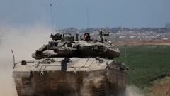 An Israeli tank manoeuvres near the Israel-Gaza border, amid the ongoing conflict between Israel and the Palestinian Islamist group Hamas, in Israel, May 16, 2024. REUTERS/Shannon Stapleton     TPX IMAGES OF THE DAY