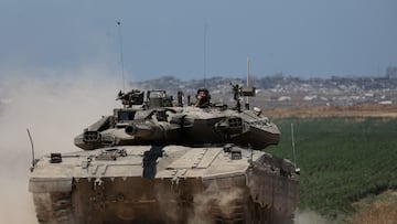 An Israeli tank manoeuvres near the Israel-Gaza border, amid the ongoing conflict between Israel and the Palestinian Islamist group Hamas, in Israel, May 16, 2024. REUTERS/Shannon Stapleton TPX IMAGES OF THE DAY