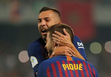 Soccer Football - Spanish Super Cup - Barcelona v Sevilla - Grand Stade de Tanger, Tangier, Morocco - August 12, 2018   Barcelona's Gerard Pique celebrates scoring their first goal with team mates   REUTERS/Jon Nazca