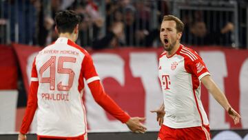 Bayern Munich's English forward #09 Harry Kane celebrates scoring his team's 2:0 with Bayern Munich's German-Serbian midfielder #45 Aleksandar Pavlovic during the German first division Bundesliga football match between Bayern Munich and VfB Stuttgart in Munich, southern Germany, on December 17, 2023. (Photo by MICHAELA REHLE / AFP) / DFL REGULATIONS PROHIBIT ANY USE OF PHOTOGRAPHS AS IMAGE SEQUENCES AND/OR QUASI-VIDEO