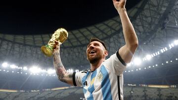 FILE PHOTO: Soccer Football - FIFA World Cup Qatar 2022 - Final - Argentina v France - Lusail Stadium, Lusail, Qatar - December 18, 2022 Argentina's Lionel Messi celebrates winning the World Cup with the trophy REUTERS/Hannah Mckay/File Photo