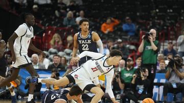 San Diego State Aztecs guard Miles Byrd (21) topples over Yale Bulldogs guard August Mahoney (3) in the second half at Spokane Veterans Memorial Arena.