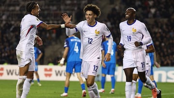France's forward #12 Maghnes Akliouche celebrates with teammateas after scoring the team's second goal during the FIFA World Cup 2026 European qualification football match between Azerbaijan and France at the Tofiq Bahramov Republican Stadium in Baku on November 16, 2025. (Photo by FRANCK FIFE / AFP)