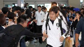 South Korea's footballer Lee Kang-in (C) arrives at Incheon international airport in Incheon on October 13, 2019 to leave for Pyongyang via Beijing. - North and South Korea face each other in a World Cup qualifier on October 15 for their first ever c