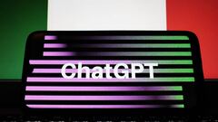 In this photo illustration a ChatGPT logo seen displayed on a smartphone screen and a flag of Italy on a MacBook screen in Athens, Greece on March 31, 2023. Italy has become the first Western country to block advanced chatbot ChatGPT over privacy concerns. (Photo Illustration by Nikolas Kokovlis/NurPhoto via Getty Images)