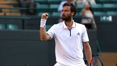 LONDON, ENGLAND - JULY 07:  Ernests Gulbis of Latvia celebrates after defeating Alexander Zverev of Germany in their Men&#039;s Singles third round match on day six of the Wimbledon Lawn Tennis Championships at All England Lawn Tennis and Croquet Club on 