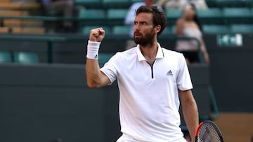 LONDON, ENGLAND - JULY 07:  Ernests Gulbis of Latvia celebrates after defeating Alexander Zverev of Germany in their Men&#039;s Singles third round match on day six of the Wimbledon Lawn Tennis Championships at All England Lawn Tennis and Croquet Club on 