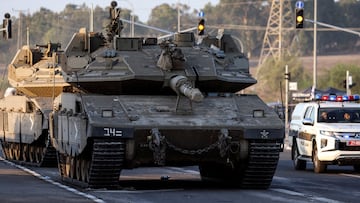 Israeli tanks seen on a road near Israel's border with the Gaza Strip, in southern Israel October 20, 2023. REUTERS/Violeta Santos Moura