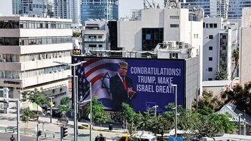 Republican presidential nominee and former U.S. President Donald Trump appears on a congratulatory billboard for the 2024 U.S Presidential Election, in Tel Aviv, Israel, November 6, 2024. REUTERS/Thomas Peter
