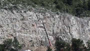 Rescue workers descend along the mountain wall on the site of the future training center of AS Monaco, in La Turbie (Alpes-Maritimes), where a worker who worked on was killed by a cliff landslide, on June 22, 2020. (Photo by Valery HACHE / AFP)