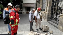Civil protection personnel check the damage to the façade of the Nuestra Señora de la Merced church moments after an earthquake in Guadalajara, Jalisco state, Mexico, on September 19, 2022. - A 6.8-magnitude earthquake struck western Mexico on Monday, shaking buildings in Mexico City on the anniversary of two major tremors in 1985 and 2017, seismologists said. (Photo by ULISES RUIZ / AFP) (Photo by ULISES RUIZ/AFP via Getty Images)