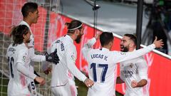 Real Madrid&#039;s Spanish defender Dani Carvajal (R) celebrates with teammates Atletico Madrid&#039;s Slovenian goalkeeper Jan Oblak&#039;s owngoal during the Spanish league football match between Real Madrid CF and Club Atletico de Madrid at the Alfredo