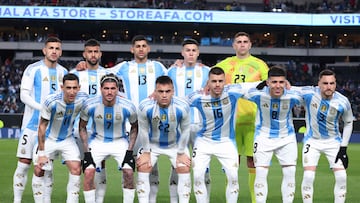 (L-R) Argentina players midfielder #05 Leandro Paredes, forward #15 Nicolas Gonzalez, defender #13 Cristian Romero, defender #02 Nehuen Perez, goalkeeper #23 Emiliano Martinez, forward #11 Angel Di Maria, midfielder #07 Rodrigo De Paul, forward #22 Lautaro Martinez, midfielder #16 Giovani Lo Celso, midfielder #08 Enzo Fernandez, defender #03 Nicolas Tagliafico pose for a team photo before the international friendly football match between El Salvador and Argentina at Lincoln Financial Field in Philadelphia, Pennsylvania, on March 22, 2024. (Photo by Charly TRIBALLEAU / AFP)