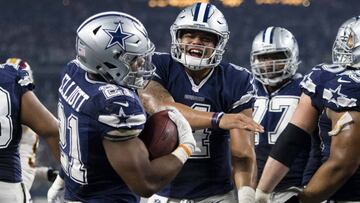 Nov 24, 2016; Arlington, TX, USA; Dallas Cowboys running back Ezekiel Elliott (21) and quarterback Dak Prescott (4) celebrate Elliott's touchdown against the Washington Redskins during the second half at AT&T Stadium. The Cowboys defeat the Redskins 31-26. Mandatory Credit: Jerome Miron-USA TODAY Sports