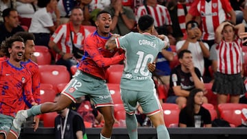 Atletico Madrid's Argentinian forward #10 Angel Correa (R) celebrates scoring with Atletico Madrid's Brazilian midfielder #12 Samuel Lino during the Spanish League football match between Athletic Club Bilbao and Club Atletico de Madrid at the San Mames stadium in Bilbao on August 31, 2024. (Photo by ANDER GILLENEA / AFP)