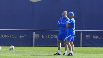 Koeman, con Alfred Schreuder.