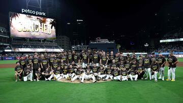 SAN DIEGO, CALIFORNIA - SEPTEMBER 22: The San Diego Padres celebrate with a team photo after beating the Milwaukee Brewers 5-4 in a game at Petco Park on September 22, 2025 in San Diego, California. With the win, the San Diego Padres advance to the Wild Card round of the MLB playoffs. Sean M. Haffey/Getty Images/AFP (Photo by Sean M. Haffey / GETTY IMAGES NORTH AMERICA / Getty Images via AFP)
