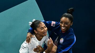 Silver medallist US' Simone Biles (R) and bronze medallist US' Jordan Chiles celebrate at the end of the artistic gymnastics women's floor exercise final during the Paris 2024 Olympic Games at the Bercy Arena in Paris, on August 5, 2024. (Photo by Lionel BONAVENTURE / AFP)