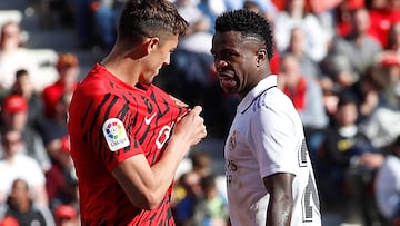 Mallorca's Spanish defender Antonio Jose Raillo (L) argues with Real Madrid's Brazilian forward Vinicius Junior during the Spanish League football match between RCD Mallorca and Real Madrid at the Visit Mallorca stadium in Palma de Mallorca on February 5, 2023. (Photo by JAIME REINA / AFP)