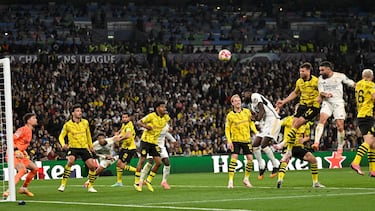 Real Madrid's Spanish defender #02 Dani Carvajal (C) scores his team's first goal during the UEFA Champions League final football match between Borussia Dortmund and Real Madrid, at Wembley stadium, in London, on June 1, 2024. (Photo by INA FASSBENDER / AFP)