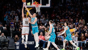 Dec 18, 2022; Denver, Colorado, USA; Denver Nuggets center Nikola Jokic (15) drives to the net against Charlotte Hornets center Mason Plumlee (24) as forward Gordon Hayward (20) and guard LaMelo Ball (1) defend in the first quarter at Ball Arena. Mandatory Credit: Isaiah J. Downing-USA TODAY Sports