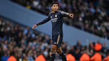 Real Madrid's English midfielder #5 Jude Bellingham recats during the UEFA Champions League quarter-final second-leg football match between Manchester City and Real Madrid, at the Etihad Stadium, in Manchester, north-west England, on April 17, 2024. (Photo by Paul ELLIS / AFP)