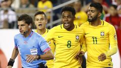 Jun 12, 2016; Foxborough, MA, USA; Brazil forward Gabriel (11) and midfielder Elias (8) and midfielder Philippe Coutinho (22) argue with referee Andres Cunha during the first half of the group play stage of the 2016 Copa America Centenario at Gillette Stadium. Mandatory Credit: Winslow Townson-USA TODAY Sports