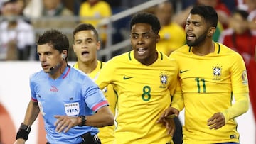 Jun 12, 2016; Foxborough, MA, USA; Brazil forward Gabriel (11) and midfielder Elias (8) and midfielder Philippe Coutinho (22) argue with referee Andres Cunha during the first half of the group play stage of the 2016 Copa America Centenario at Gillette Stadium. Mandatory Credit: Winslow Townson-USA TODAY Sports