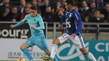 Strasbourg&#039;s French defender Kenny Lala (R) vies with Olympique de Marseille&#039;s French midfielder Maxime Lopez during the French L1 football match between Strasbourg (RCSA) and Marseille (OM) on May 3, 2019 at the Meinau stadium in Strasbourg, ea