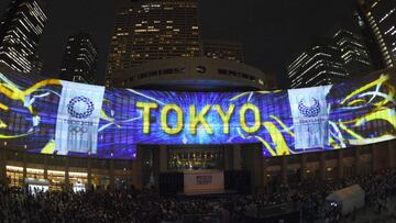 (FILES) This file photo taken on July 24, 2017 shows a projection during a ceremony marking three years to go before the start of the Tokyo 2020 Olympic games at the Tokyo Metropolitan Assembly Building.
 Tokyo will complete its first venue for the 2020 Summer Olympic Games next March, organisers said on November 3, 2017, with the Musashino Forest Sport Plaza to host badminton, fencing and modern pentathlon events. / AFP PHOTO / Kazuhiro NOGI