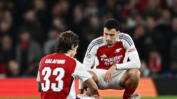 Soccer Football - Champions League - Arsenal v Shakhtar Donetsk - Emirates Stadium, London, Britain - October 22, 2024 Arsenal's Riccardo Calafiori reacts after sustaining an injury as Gabriel Martinelli looks on REUTERS/Dylan Martinez