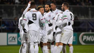 Lyon's players celebrate after scoring a goal during the French Cup round of 64 football match between Bourg-en-Bresse (FBBP) and Lyon (OL) on January 4, 2020 at the Stade Marcel-Verchere Stadium in Bourg-en-Bresse. (Photo by ROMAIN LAFABREGUE / AFP)