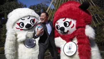 Former Japanese football player Yasutaro Matsuki poses with mascots Ren (L) and G (R) during a photo session to unveil the official mascots of the Rugby World Cup 2019 in Tokyo, on January 26, 2018.
 Blending its love of all things cute with its rich cult