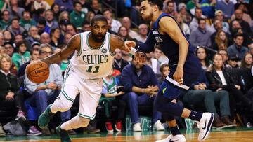 BOSTON, MA - JANUARY 4: Kyrie Irving #11 of the Boston Celtics drives against Tyus Jones #1 of the Minnesota Timberwolves during the second half at TD Garden on January 5, 2018 in Boston, Massachusetts. The Celtics defeat the Timberwolves 91-84. Maddie