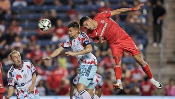 Aug 1, 2024; Bridgeview, Illinois, USA; Toluca forward Joao Paulo Dias Fernandes (26) and Chicago Fire FC midfielder Gaston Gimenez (30) during the first half of a match at SeatGeek Stadium. Mandatory Credit: Melissa Tamez-USA TODAY Sports