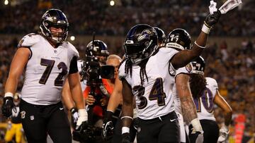 PITTSBURGH, PA - SEPTEMBER 30: Alex Collins #34 of the Baltimore Ravens celebrates after a 3 yard touchdown reception in the first quarter during the game against the Pittsburgh Steelers at Heinz Field on September 30, 2018 in Pittsburgh, Pennsylvania.