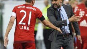 Lahm y Guardiola.