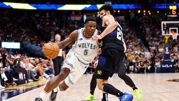 DENVER, COLORADO - MAY 19: Anthony Edwards #5 of the Minnesota Timberwolves drives to the basket against Jamal Murray #27 of the Denver Nuggets during the fourth quarter in Game Seven of the Western Conference Second Round Playoffs at Ball Arena on May 19, 2024 in Denver, Colorado. NOTE TO USER: User expressly acknowledges and agrees that, by downloading and or using this photograph, User is consenting to the terms and conditions of the Getty Images License Agreement. C. Morgan Engel/Getty Images/AFP (Photo by C. Morgan Engel / GETTY IMAGES NORTH AMERICA / Getty Images via AFP)