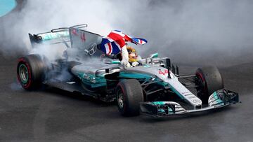 MEXICO CITY, MEXICO - OCTOBER 29: Lewis Hamilton of Great Britain and Mercedes GP celebrates after winning his fourth F1 World Drivers Championship during the Formula One Grand Prix of Mexico at Autodromo Hermanos Rodriguez on October 29, 2017 in Mexico C